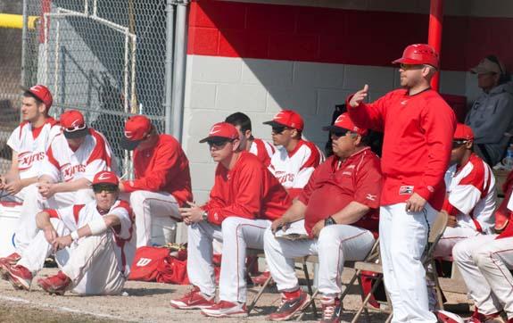 Assistant coach Scott Tesluck, standing, adjusts the defense. The Express saw their season end today with two tough losses in the sub-district tourney. Photo by Seth Foley