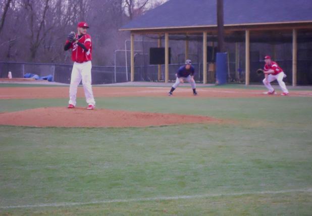 Zak Esposito looks to deliver a pitch against No. 3 Louisburg College as Myles Debol awaits a possible pickoff attempt at first base. The Express lost 13-5. Photo courtesy of Owens Sports Information