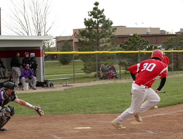 Travis Tackett lays down a perfect bunt for a single in the sixth inning of the second game. It would prove to be the game winning run as Michael Louis pinch ran for him, stole second and scored on a two-run single by Ryan Horvath. Below is Louis crossing the plate along with Manis on Horvath's single. Photos courtesy of Cherie Guthrie/Owens Sports Information
