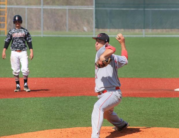 Sam Hackney delivers a pitch in today's first game against Lourdes University JV. Hackney and four other pitchers combined to hold Lourdes to three runs today. Photo by Nicholas Huenefeld/Owens Sports Information