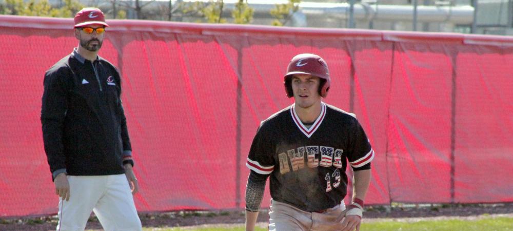 Wichlacz takes a lead off third in a recent game as head coach John Parisho looks on. Photo by Nicholas Huenefeld/Owens Sports Information