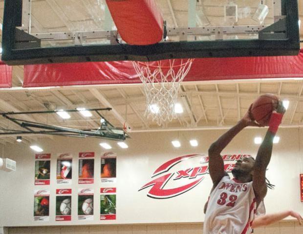 Justin Edmonds looks to score a basket against Sinclair. The freshman guard led the Express with a career high 32 points, while adding four assists and three steals, in the 88-85 win. Photo by Seth Foley