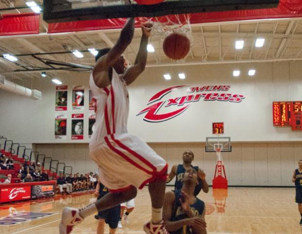 Freshman forward James Kelly throws one down on an assist from Jeff Burroughs against Edison State. Kelly finished with 18 points and eight rebounds. Photo by Seth Foley