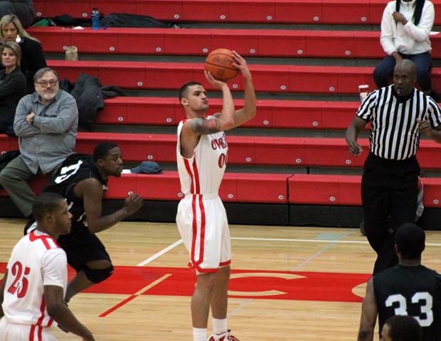 Andy Bachman makes one of his four 3-pointers today. He finished with 18 points. Photo by Dave Harrand/Owens Sports Information