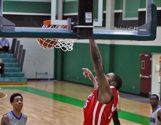 James Kelly throws down a left handed dunk off a pass in the district championship game against Lakeland Community College. The sophomore earned First Team All-OCCAC honors en route to helping the Express capture the district title. Photo by Nicholas Huenefeld/Owens Sports Information