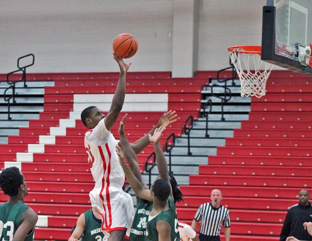 James Kelly rises for a shot in the paint. The sophomore finished with team-highs in points (21), rebounds (8) and blocks (3) in a 117-47 win over Washtenaw Community College in the SHAC tonight. Photo by Rudy Yovich/Owens Sports Information