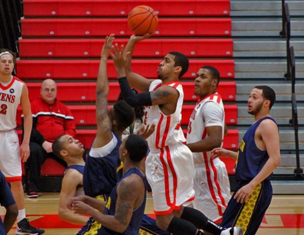 Joe Retic goes up for two of his 13 points. He would add team-highs in rebounds (12), assists (11) and steals (3). Photo by Dave Harrand/Owens Sports Information