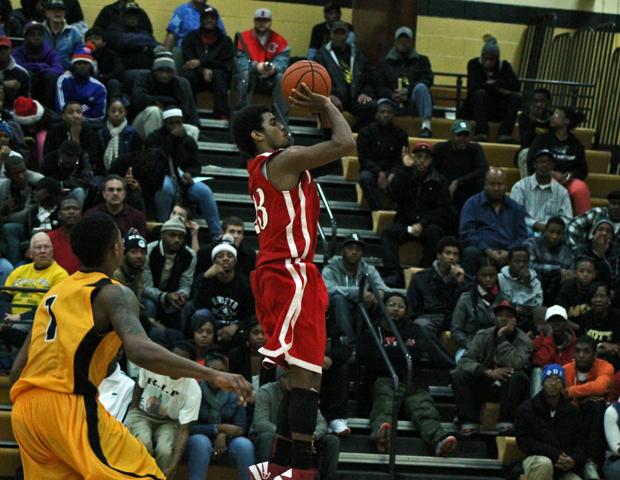 Joe Retic II hits a 3-pointer in transition (pictured here) to pull the Express within four late. No. 4 Mott, however, regained control to win 76-68. Photo by Nicholas Huenefeld/Owens Sports Information
