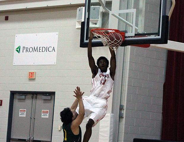 Kenny Jones skies for a dunk in the second half of today's 128-66 season-opening win over Washtenaw. Photo by Nicholas Huenefeld/Owens Sports Information
