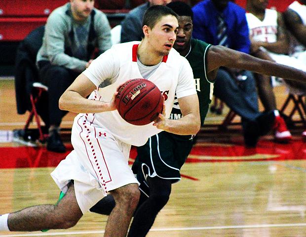 Pete Firlik looks to make a pass in today's 112-69 win over Ivy Tech. Photo by Nicholas Huenefeld/Owens Sports Information