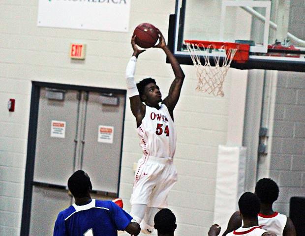 Kenny Jones skies his way to a second half dunk in today's 31 point win over Kellogg Community College. Photo by Nicholas Huenefeld/Owens Sports Information