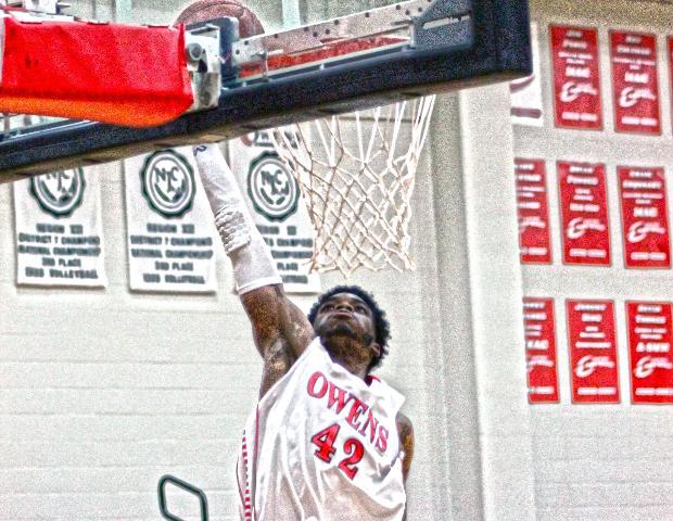 Kenny Jones hammers home a fast break dunk in the first half of today's 117-78 win over Sinclair today. Photo by Tobias Flemming/Owens Sports Information