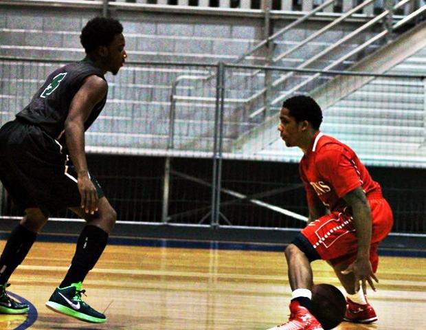 Shaakir Lindsey looks to make a move against CCRI's Anthony Jernigan in today's 99-63 win. The sophomore had 30 points, 8 assists and five steals. Photo by Nicholas Huenefeld/Owens Sports Information