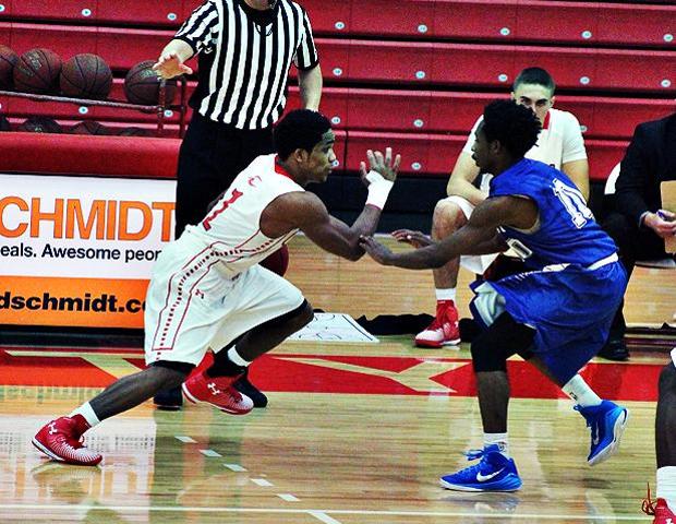 Shaakir Lindsey dances past Wayne County's Michael Jackson in tonight's 100-92 victory. Photo by Nicholas Huenefeld/Owens Sports Information