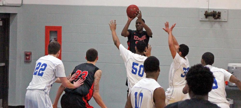Derrik Jamerson Jr. rises for a 3-point field goal attempt in the first half of today's game. Photo by Nicholas Huenefeld/Owens Sports Information