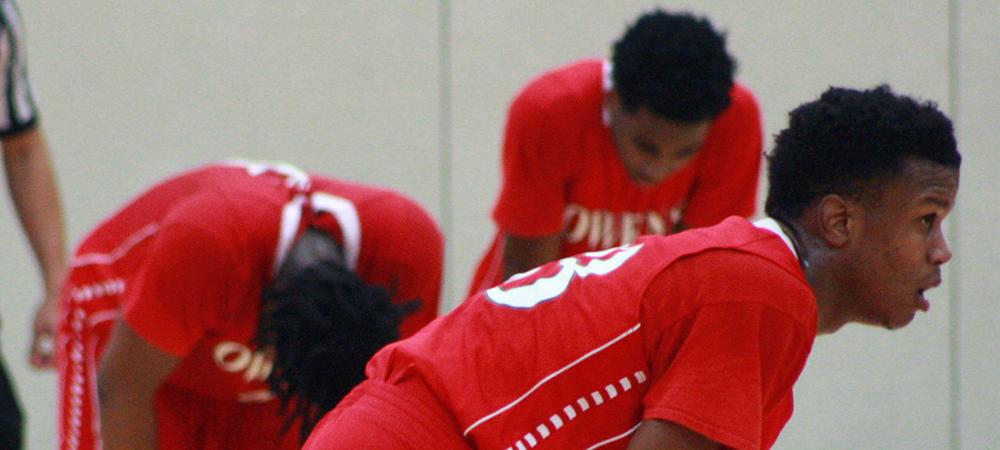 Dae'Shawn Jackson, front, is pictured near the end of the game along with Xavier Cochran and Brian Walker. Photo by Kyle Brown/Owens Sports Information