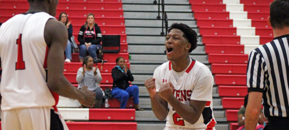 Roy Hatchett (right) celebrates a late stop with Derrik Jamerson in Tuesday's win over No. 9 Lansing. Photo by Nicholas Huenefeld/Owens Sports Information