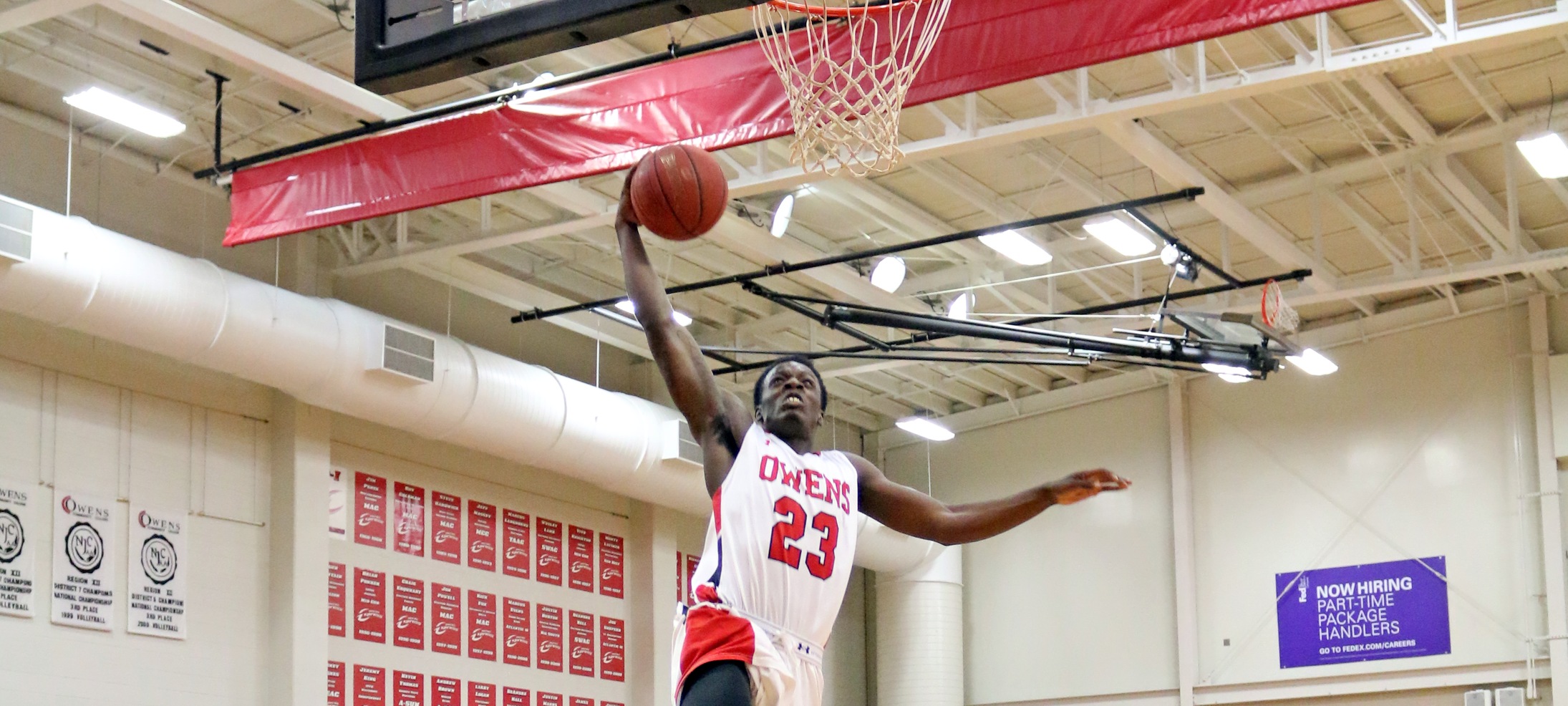 Rico Stafford skies for a slam during the first half of tonight's 83-72 loss to Jackson College. Photo by David Bliss/Owens Sports Information