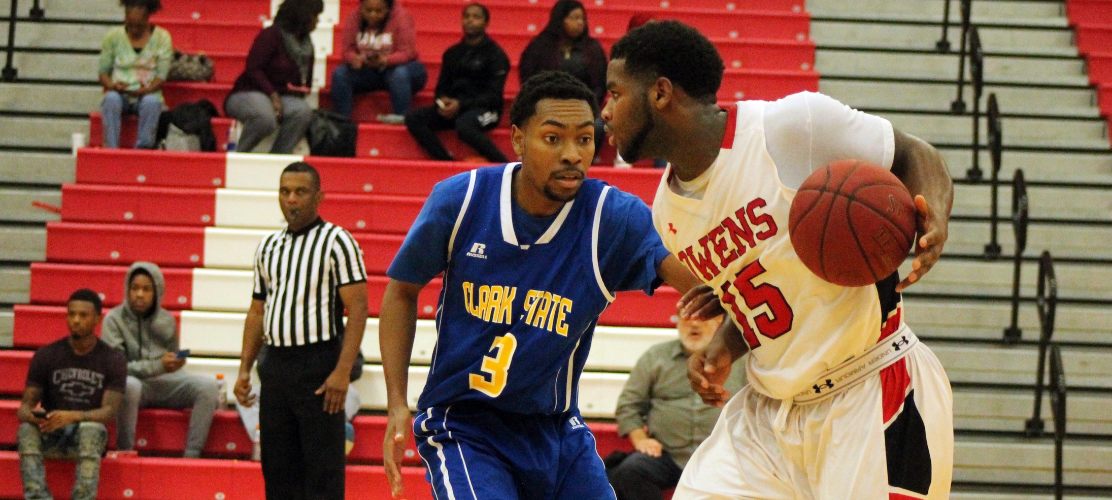 Marquevious Wilson looks to make a move against Clark State's Isaiah Boyd in today's 87-52 win. Photo by Nicholas Huenefeld/Owens Sports Information