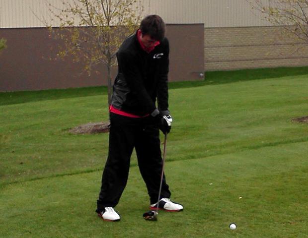 Greg Hermes prepares a practice swing during action in the A.C. Eddy Invitational. He would finish as the third low scorer on the team with a 78. Photo by Josh Williams/Owens Sports Information