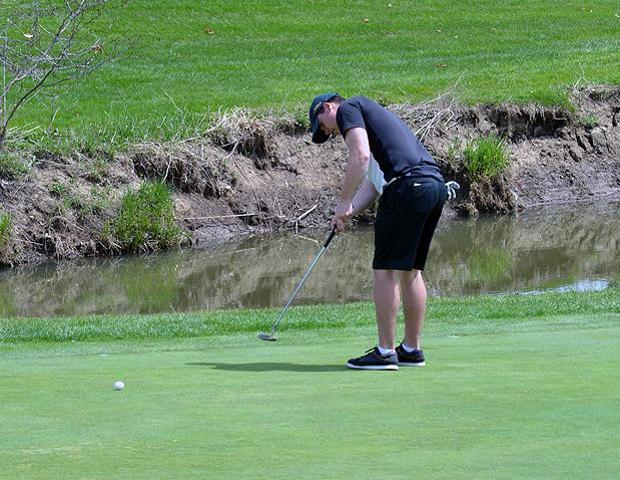Freshman Kirby Manown attempts a putt. Photo by Josh Williams/Owens Sports Information