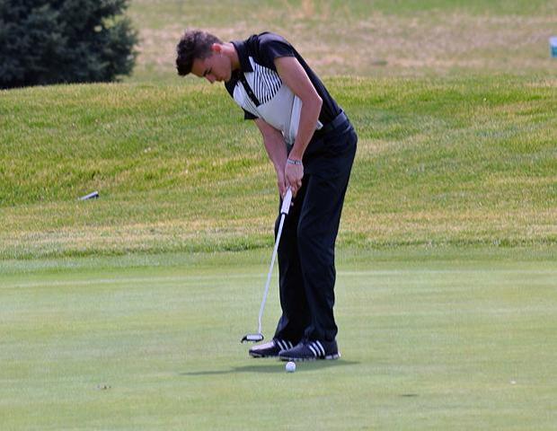 Brandon Hoelzer attempts a putt. He captured medalist honors in today's tournament. Photo by Josh Williams/Owens Sports Information