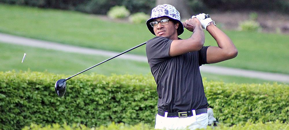 Christian Bienaime follows one of his shots after teeing off in today's Owens Invitational. His 77 helped Owens capture first place. Photo by Nicholas Huenefeld/Owens Sports Information