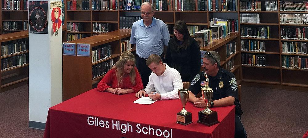 David Sadler, front center, will play golf at Owens next year. He is surrounded by his parents, Darlene and Doug (sitting down), his high school coach W.R. Johnston and his sister Ashley. Photo provided to Owens Sports Information