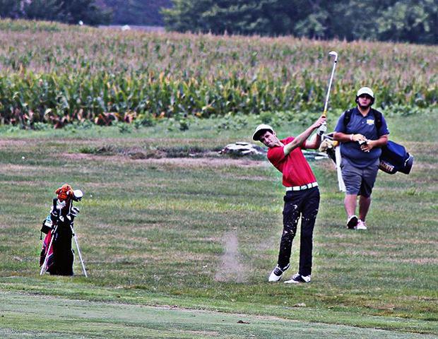 Philippe Weppernig takes a shot while one of his opponents looks on. Photo by Nicholas Huenefeld/Owens Sports Information