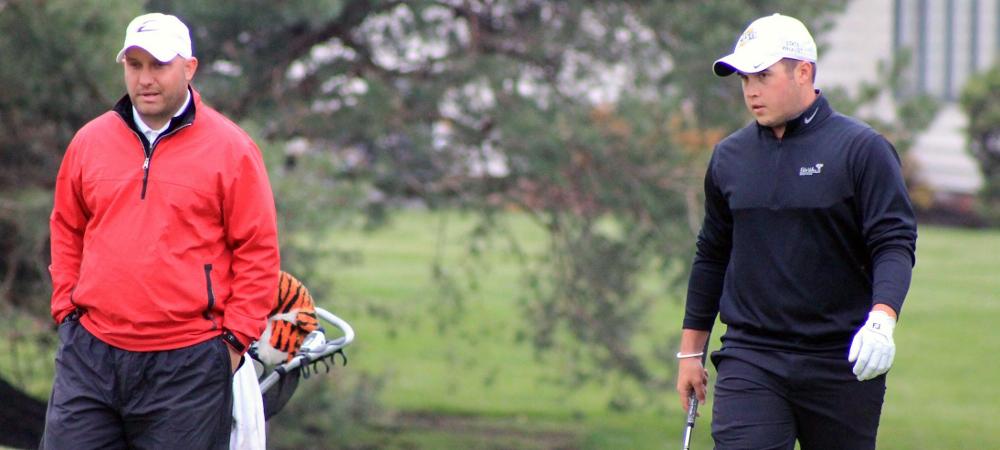 Dylan Holsclaw gets advice on his shot from head coach Josh Williams during a recent tournament. Photo by Nicholas Huenefeld/Owens Sports Information