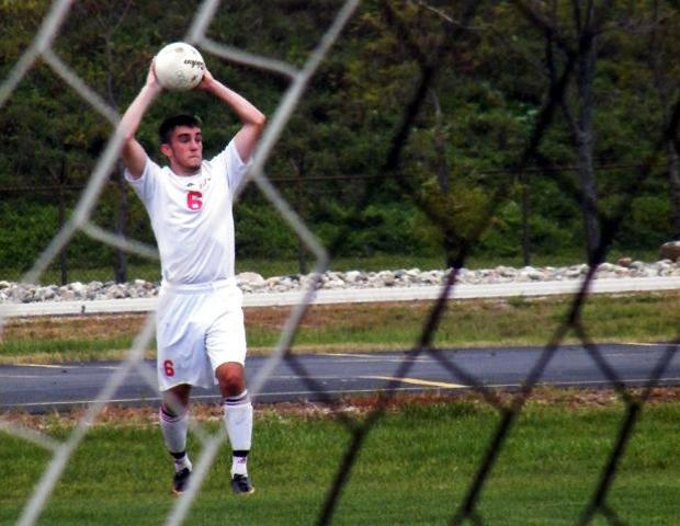 Chris Kervick looks to throw the ball in against Schoolcraft. Photo by Nicholas Huenefeld