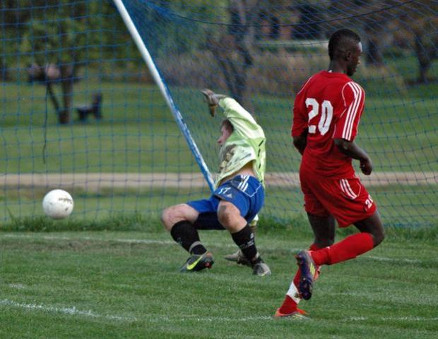Nickyle Webber puts one past Cuyahoga's goalkeeper for his third goal of the game on Oct. 3. The sophomore earned OCCAC men's soccer player of the week honors for producing four goals and three assists during the week. Photo by Nicholas Huenefeld/Owens Sports Information