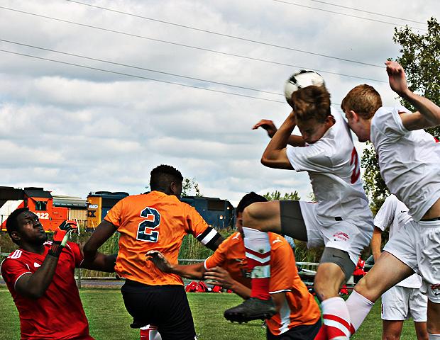 Nathan Francis (far right) out-duels his teammate Cooper Huslig for a goal late in today's first half against Morton College. Photo by Nicholas Huenefeld/Owens Sports Information
