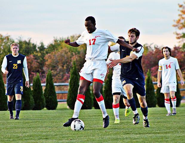 Trae Green (17) is played by a Schoolcraft defender in today's 3-2 loss. Photo by Jessica Grindle/Owens Sports Information