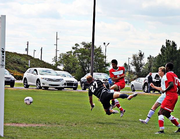 Ahmad Jarrar beats Cincinnati State's goalkeeper for the lone Owens goal in today's 3-1 loss. Photo by Nicholas Huenefeld/Owens Sports Information