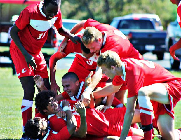 Josiah McCLoud is mobbed by his teammates after scoring the game winning goal with 30 seconds left in regulation. Photo by Nicholas Huenefeld/Owens Sports Information