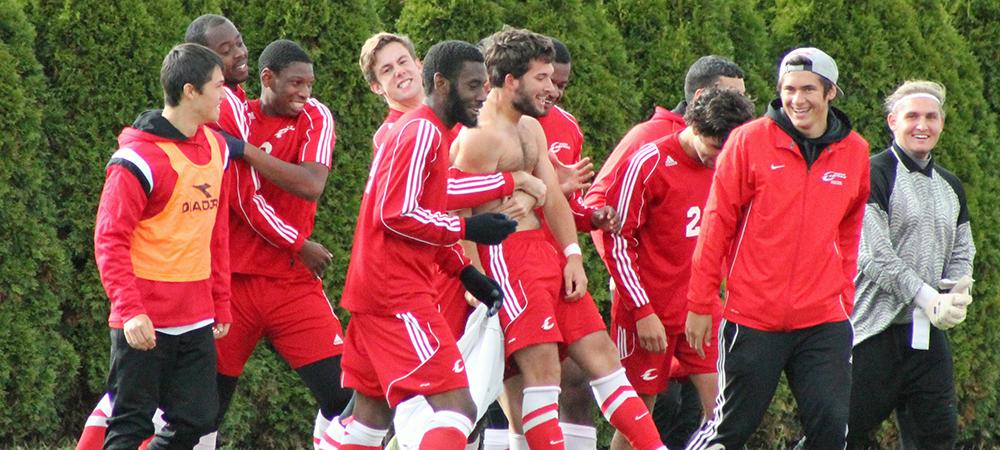 Matt Almester, shirtless, is congratulated by his teammates after scoring the game-winning goal in double overtime today. Photo by Nicholas Huenefeld/Owens Sports Information