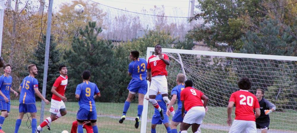 Maxwell Ejiogu (6) makes a play in the air against Muskegon in today's 2-0 win. Photo by Nicholas Huenefeld/Owens Sports Information