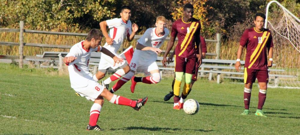 Reiss Liggitt is pictured here scoring the game winning goal in OT. Photo by Nicholas Huenefeld/Owens Sports Information