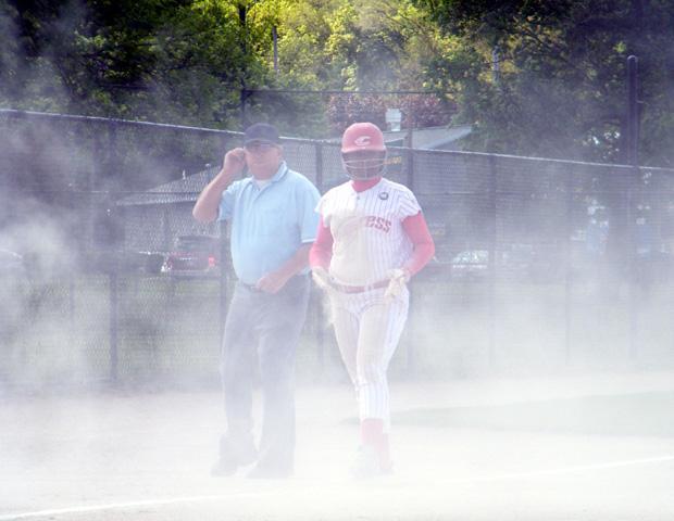 Aja Hall stands in a cloud of dust after stealing third against No. 10 KVCC. She had an RBI double prior to that to put the No. 12 Express up 1-0 early. Below left, Michelle Hollister takes a swing vs KVCC. The sophomore led the team with 48 RBIs and was the only player to start all 48 games. She finished her career with 87 RBIs. Below right, Kasey Graham delivers the final pitch of her career and the 2012 Express season. She finished her career 18-1. Photos by Nicholas Huenefeld/Owens Sports Information
