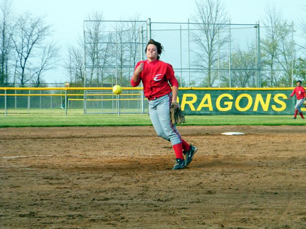 Kasey Graham delivers a pitch against Tiffin JV. The sophomore allowed only two hits while picking up her third win this year in a 10-0 win. She has now pitched nine consecutive scoreless innings. Below, Mareshah Scott puts a ball in play in the second game. Photos by Nicholas Huenefeld/Owens Sports Information