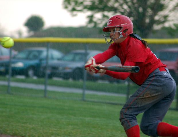 Melanie Iacoangeli prepares to connect with the ball in the second game. The freshman went 4-for-5 with four runs, three walks and five stolen bases in the doubleheader. Below, Kasey Graham looks for someone to throw to during the third inning of the second game. Photos courtesy of Sharon Snyder/Owens Sports Information