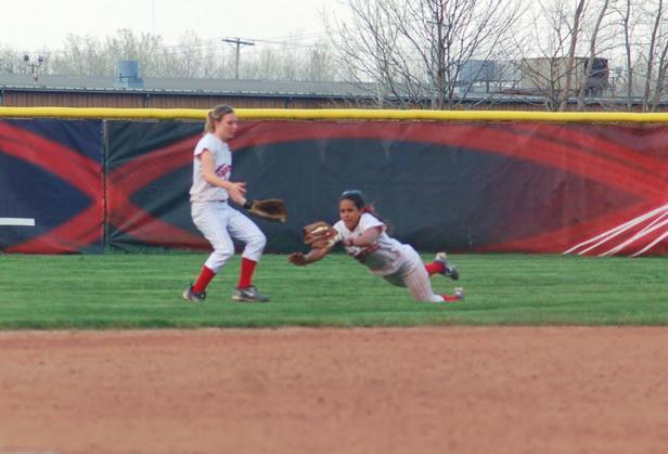 Express centerfielder Mareshah Scott makes a diving catch in left centerfield during the first at bat of the second game today. Scott had a big first game offensively as she finished 3-for-4 with two RBIs. Pictured below is Michelle Hollister hitting her solo homer in the second game. Photos courtesy of Sharon Snyder/Owens Sports Information