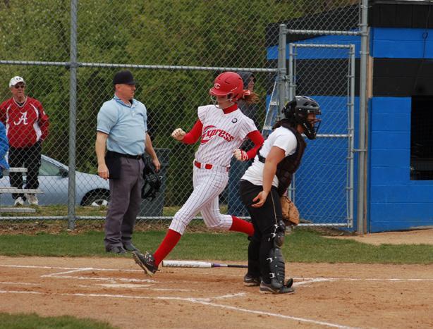 Hallie Thompson scores against No. 17 Mercyhurst NE. The sophomore shortstop was 3-for-3 with two triples, two runs and an RBI against them. Just below, Melanie Iacoangeli slides in safely as she stole her 28th and 29th bases of the season today. Far below, Ashlyn Michalak delivers against Mercyhurst NE. Photos courtesy of Sharon Snyder/Owens Sports Information