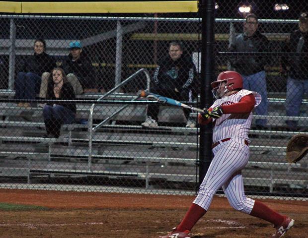Molly Gast delivers one of her two extra base, RBI hits against Coastal Carolina. Photo by Nicholas Huenefeld/Owens Sports Information