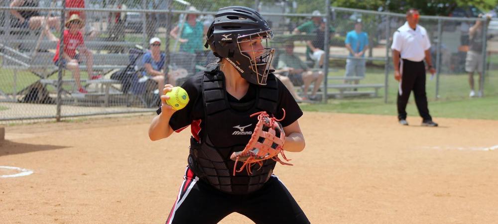 Sophomore catcher Josie Hall checks a runner back to first in yesterday's 22-18 win over Sauk Valley. Photo by Nicholas Huenefeld/Owens Sports Information