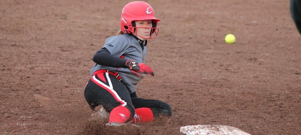 Emily Young slides safely in to third base as the throw from the outfield comes in late. Photo by Nicholas Huenefeld/Owens Sports Information