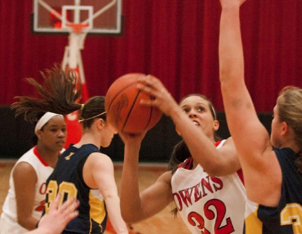 Sophomore center Hailey Galvan looks to score against Edison Community College. The sophomore center broke the program's single season block record tonight and now has 129 this season. Photo by Seth Foley