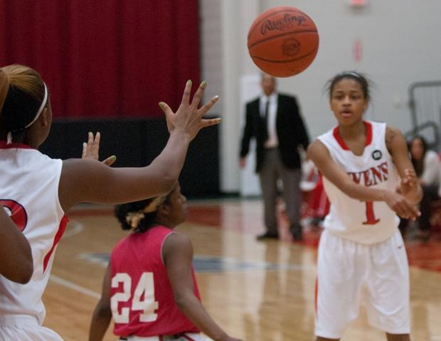 Uniqua Mitchell feeds the ball to Karahn Scott in the post. Mitchell led the Express over OSU Club tonight with her 19 points, 12 rebounds, four assists, one block and one steal.