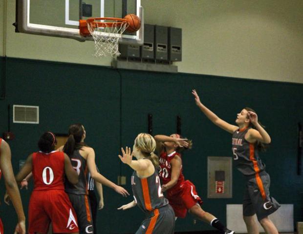 Emma Ricketts scores one of her 11 points against Central Wyoming. The sophomore also had 11 rebounds, two assists and two blocks. Photo by Nicholas Huenefeld/Owens Sports Information